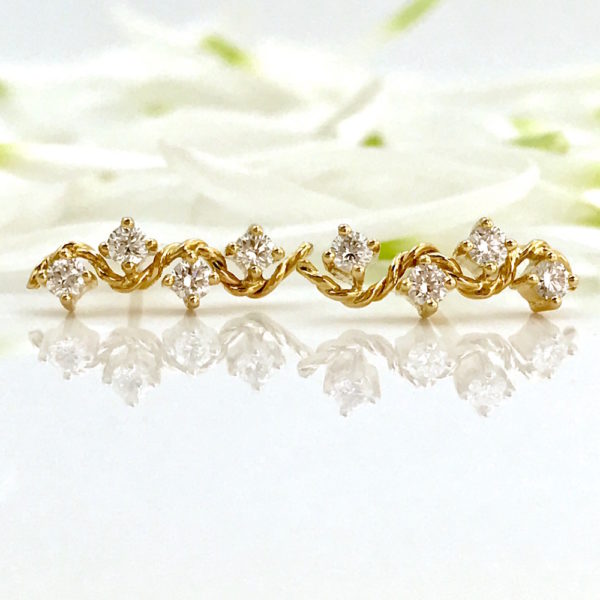 18k Gold Diamond Twist Wave Enlace Stud Earrings combine prong set diamonds with Jewelyrie's signature touch of PirouetteTwist.