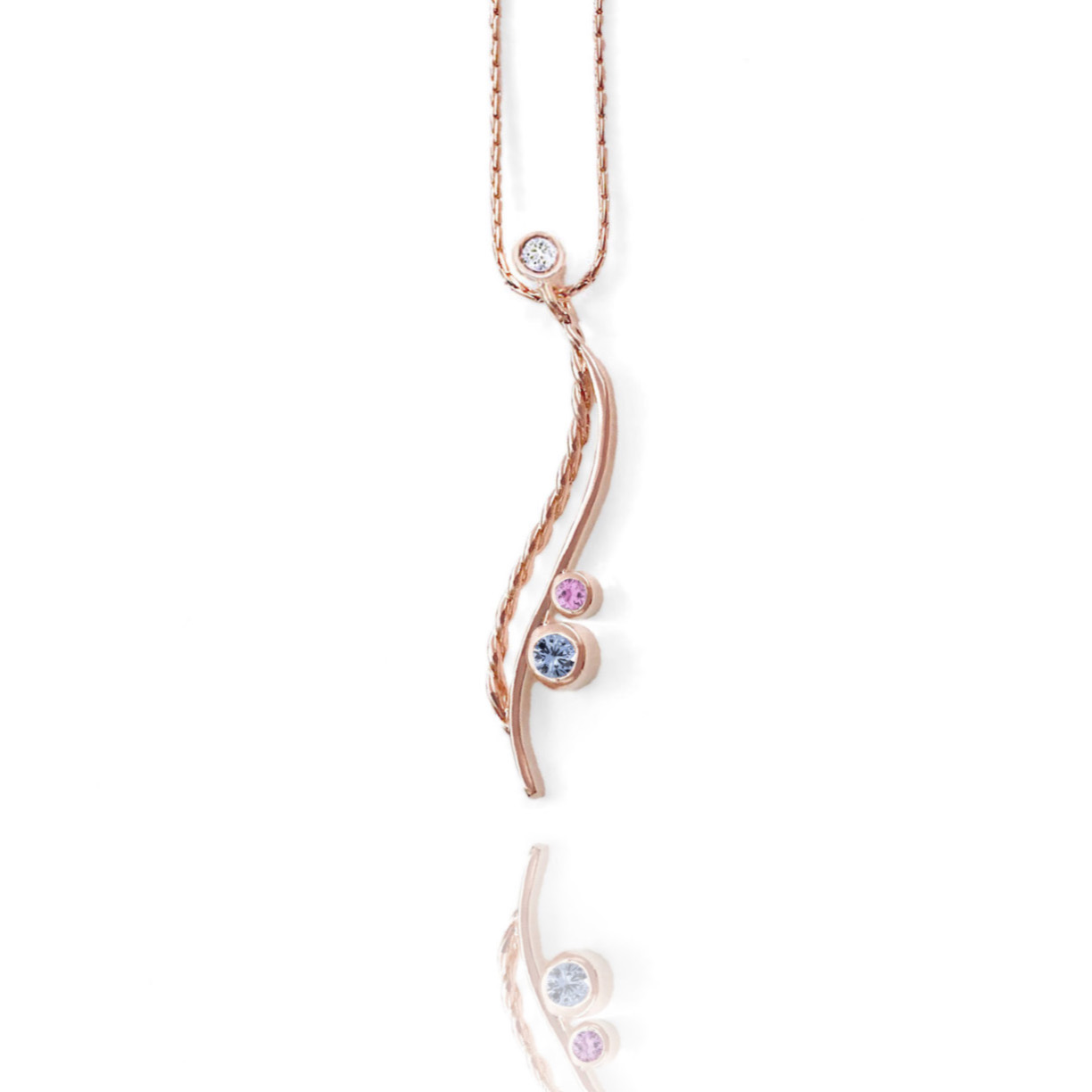 JeweLyrie-blue-pink-sapphire-diamond-accent-twist-wave-pendant-necklace-RW
