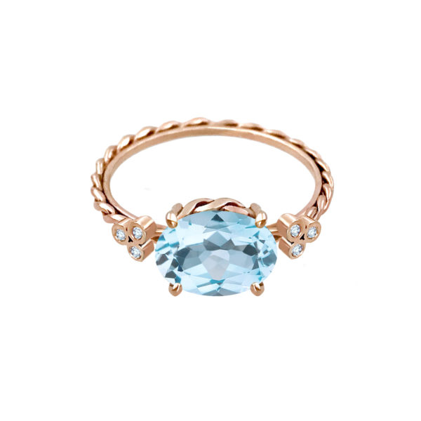 East-west oval sky blue topaz and diamond ring with signature twist setting and shank handcrafted in 14k and 18k made to order by JeweLyrie free domestic shipping